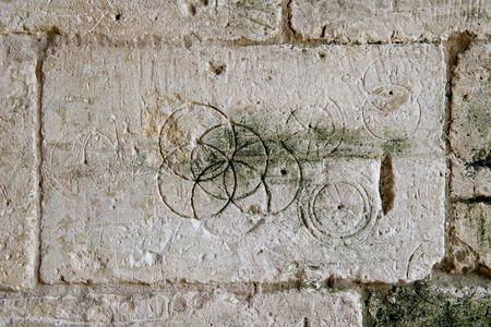 These daisy wheels were found in Saxon Tithe barn in Bradford-on-Avon. 
