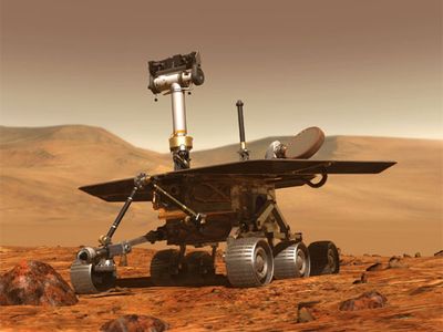 Since early 2004, the Mars rovers have gathered images of rocks and terrain where water, the presumed prerequisite of life, once flowed (an artist's rendition).
