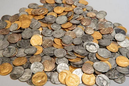 The 404 coins discovered in a muddy field near Bunnik, a village in the Netherlands, in 2023 and 2024