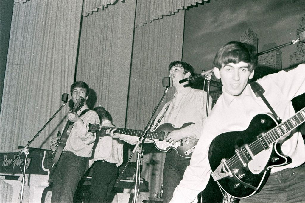 John Lennon, Paul McCartney and George Harrison perform at the Star-Club in Hamburg, Germany, in May 1962