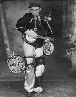 Sid’s one-man-band vaudeville act.