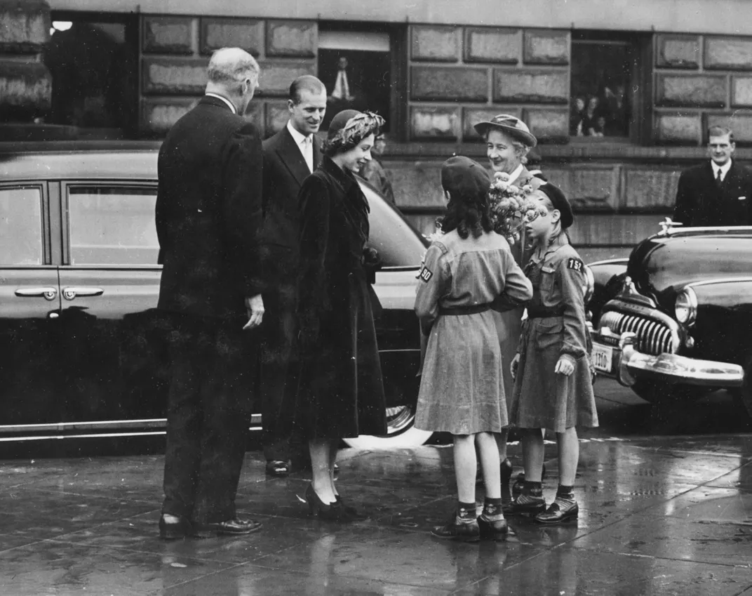 Elizabeth chats with Girl Scouts outside of the Library of Congress in Washington, D.C. in November 1951.