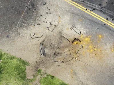 An American Bomb Left Over From World War II Explodes at an Airport Taxiway in Japan image