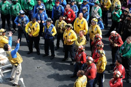 110706-N-QL471-084
ARABIAN GULF (July 6, 2011) Senior Chief Aviation Boatswain's Mate (Handling) Martin Jimenez gives Sailors a safety briefing before flight deck safety drills aboard the aircraft carrier USS George H.W Bush (CVN 77). George H.W. Bush is deployed supporting maritime security operations and theater security cooperation efforts in the U.S. 5th Fleet area of responsibility on its first operational deployment. (U.S. Navy photo by Mass Communication Specialist 3rd Class Billy Ho/Released)