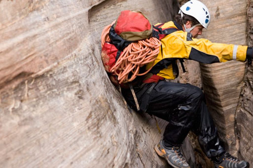 Man bridging across canyon