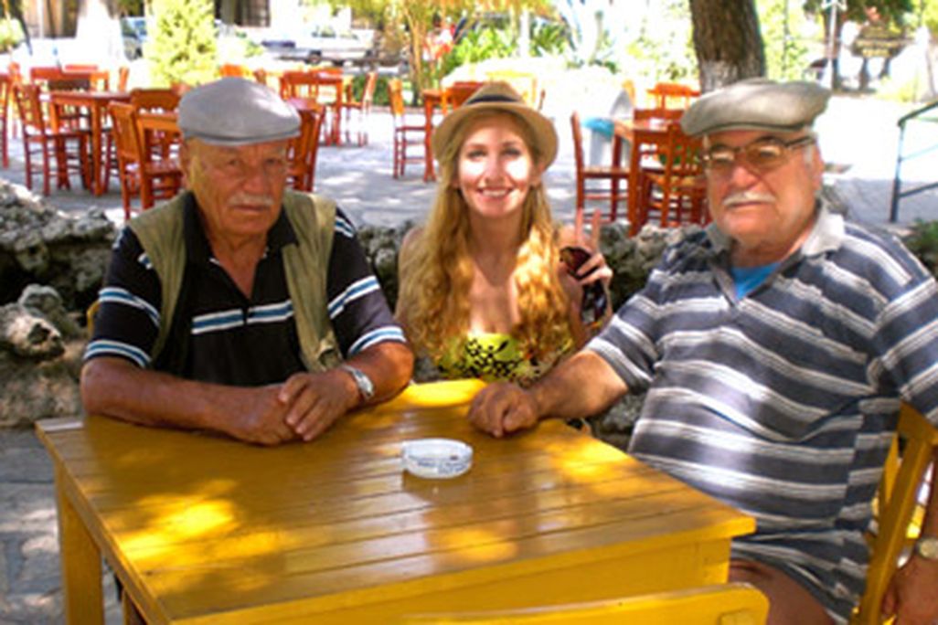 American backpacker Julia Pasternack shares a moment with two Turkish gentlemen.