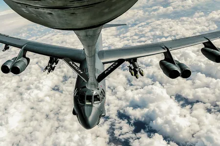 In the skies above Iraq in 2017, a KC-135 Stratotanker pumps gas into a B-52 Stratofortress. KC-135s and B-52s have hooked up for more than 60 years.