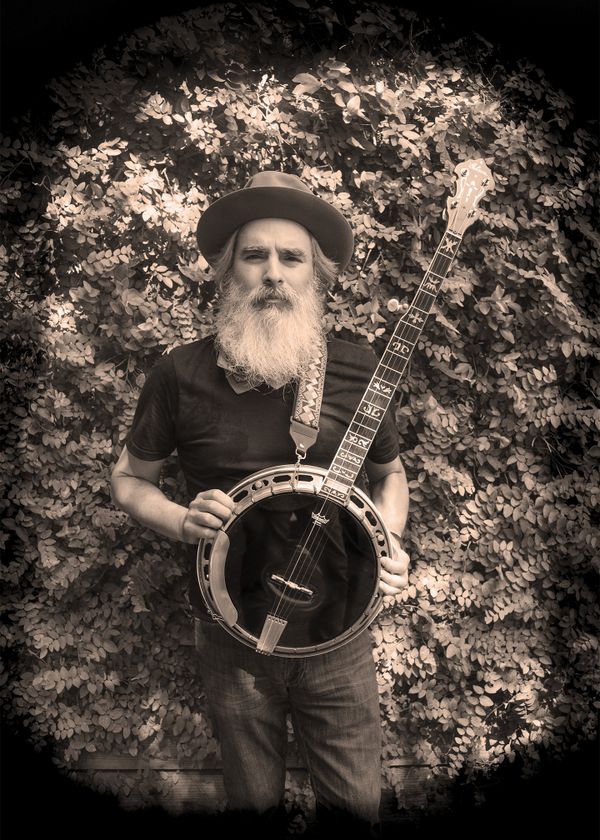 Chuck Leah with 1930's banjo. Sony a7II with 32mm Zeiss Touit thumbnail