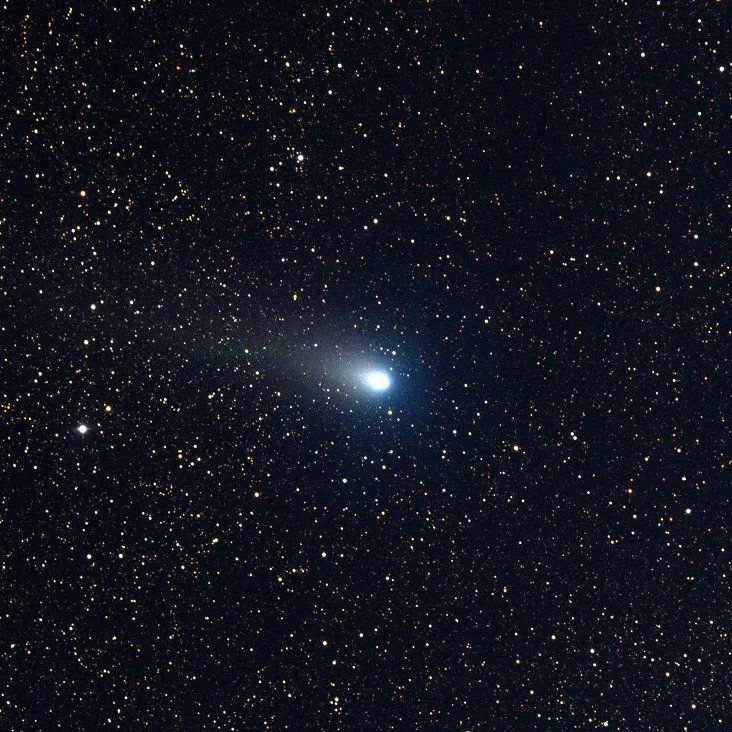 a bright comet against a backdrop of stars