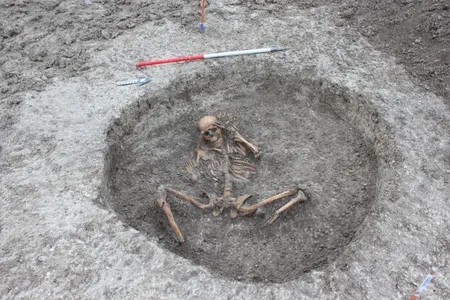 A Neolithic woman was buried with her arms bound behind her head and her amputated feet placed on either side of her body