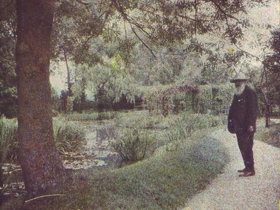 A photograph of Claude Monet in his gardens circa 1917