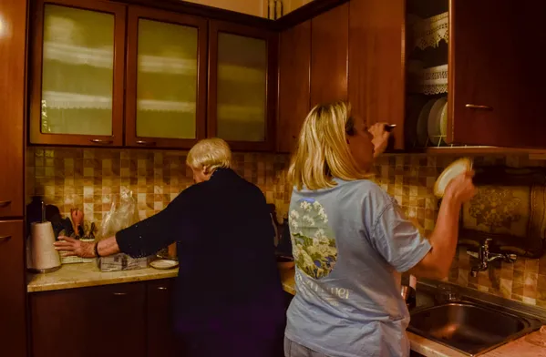 Two women in the warm kitchen light thumbnail