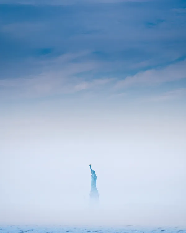 Fog lifting on the Statue of Liberty thumbnail