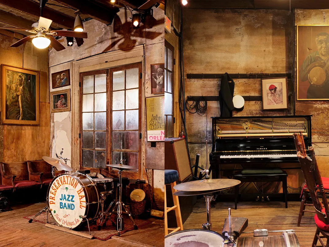 a drumset and piano inside a jazz hall