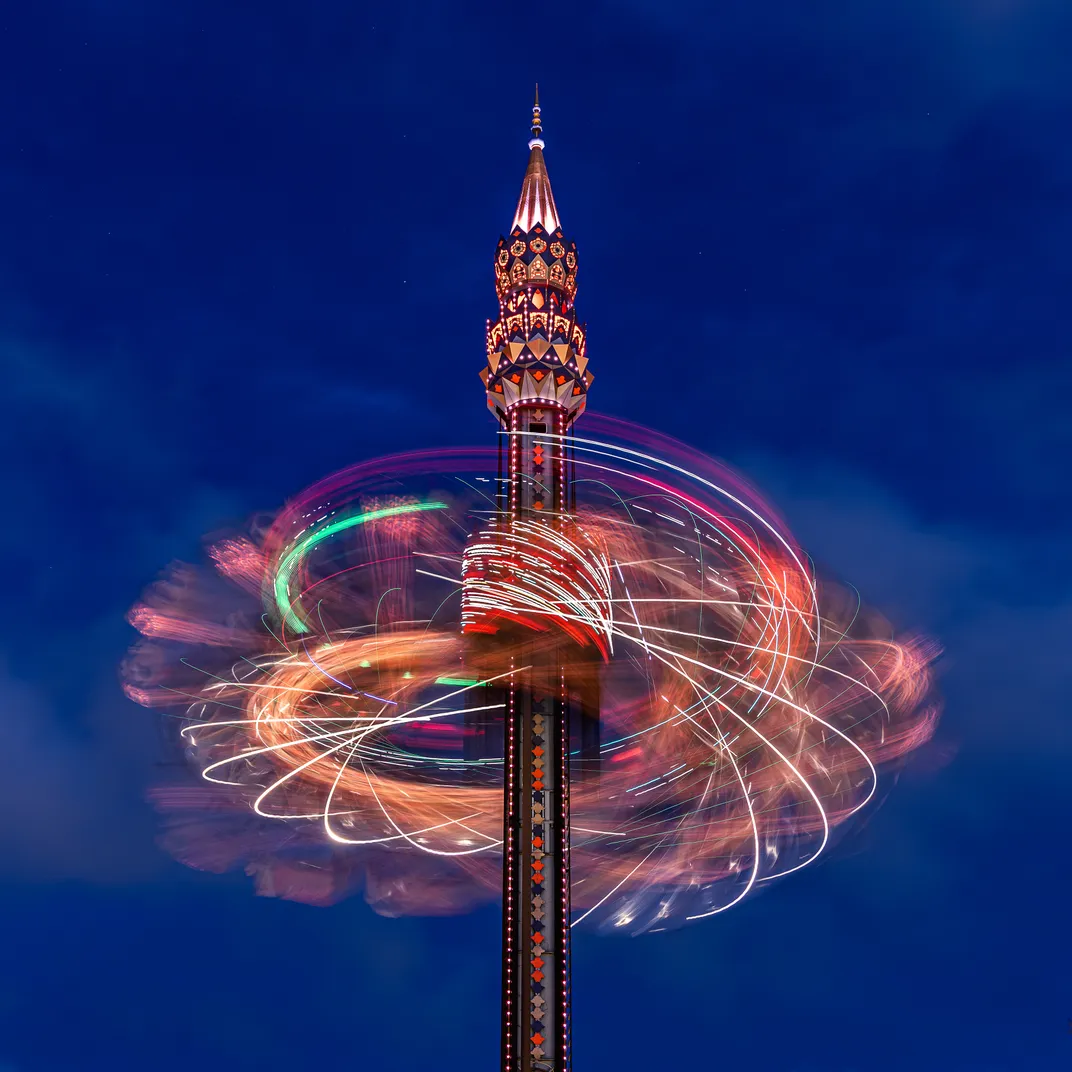 A night shot of a swig ride