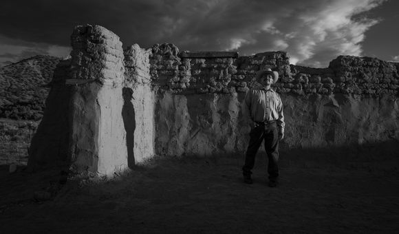 Genízaro Delvin Garcia standing in remains of the 18th-century Santa Rosa de Lima Church. Abiquiú, New Mexico, 2019. (© 2020 Russel Albert Daniels) 