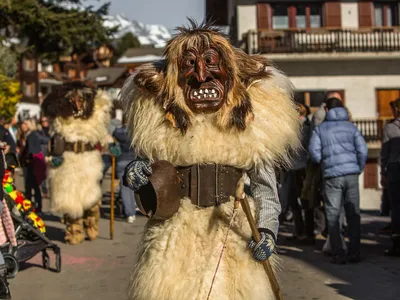 A&nbsp;L&ouml;tschental&nbsp;Valley resident dressed as a Tsch&auml;g&auml;tt&auml; strolls around the village of&nbsp;Wiler, in Valais, Switzerland moments before the annual Carnival Parade begins.