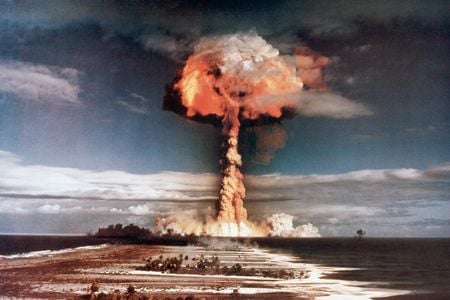 A mushroom cloud rises in the sky during an atomic weapons test in the 1950s.