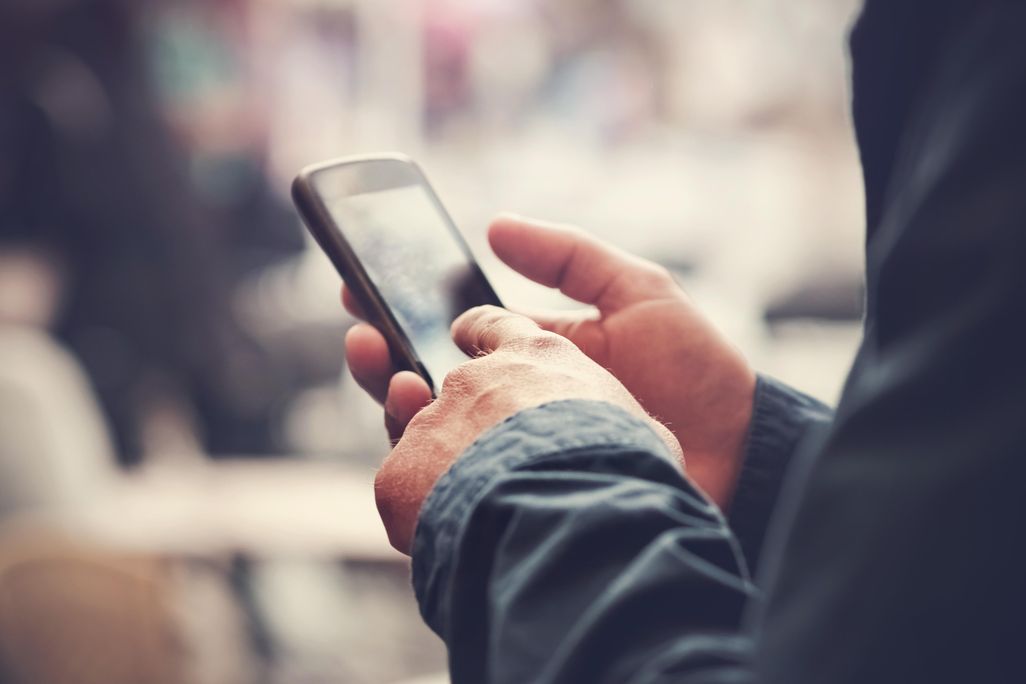 man holding cell phone.jpg