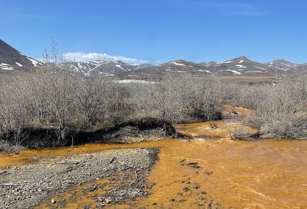 An orange tributary of the Kugororuk River.