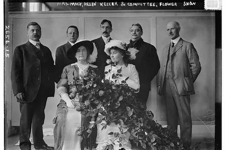 Helen Keller and Anne Sullivan Macy at a New York flower show, circa 1913.