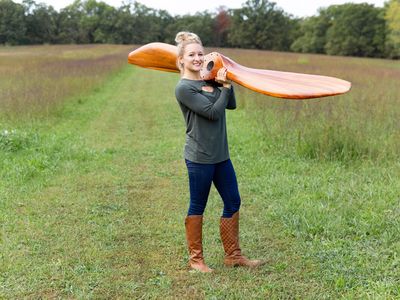 Alaina Lewis with the 90-inch mahogany propeller she made for a Bristol F.2 Fighter, her most challenging job to date.