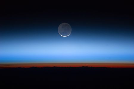International Space Station astronauts captured this photograph of Earth's atmospheric layers. The troposphere is the orange-red layer. The gray, just above that, is the stratosphere. Then, the blue is the mesosphere.
