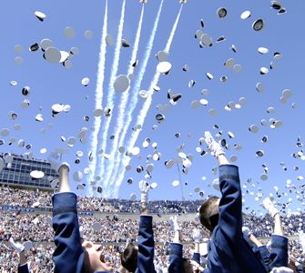 1046 newly commissioned 2nd Lieutenants commemorate their achievement by tossing their hats as the Air Force Thunderbirds fly over Falcon Stadium May 27. US Air Force Photo/Dennis Rogers