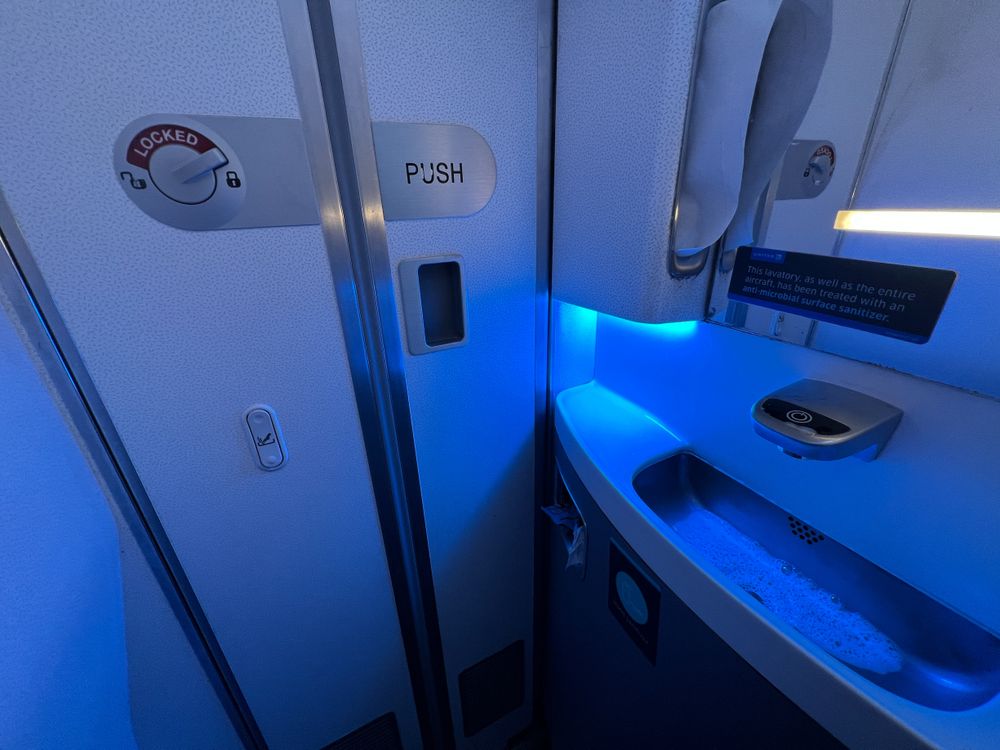 Blue light glowing inside airplane lavatories