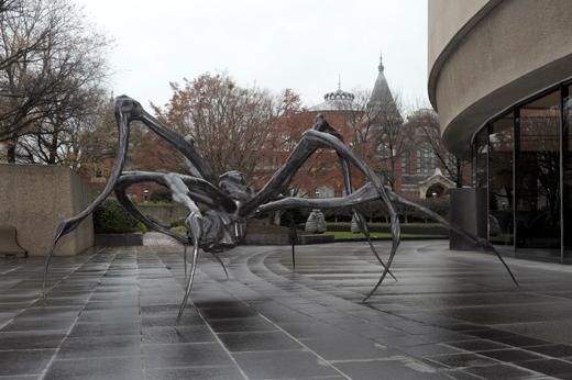 A spider lunges at its wasp prey for all eternity.