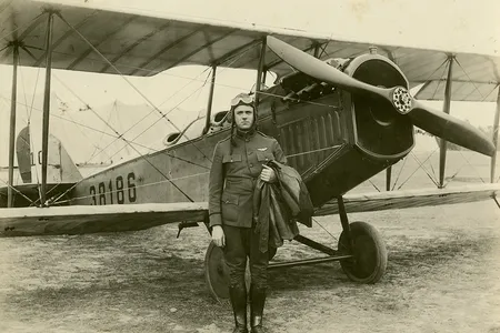 We know that Elmo Pickerill, here with a Curtiss JN-4H Jenny, was a U.S. Army Air Service lieutenant in 1918. About his claims to earlier flights, we’re not so sure.
