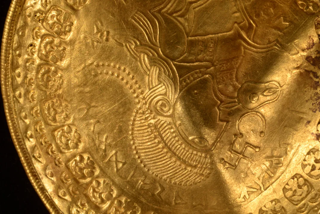 Close-up view of gold artifact found in the cache