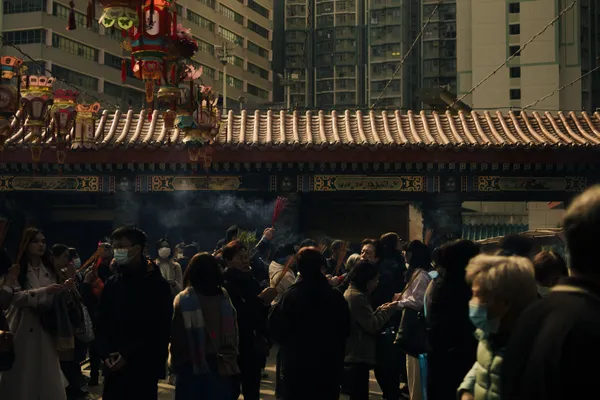 People gather at the temple to burn incense for Chinese New Year thumbnail