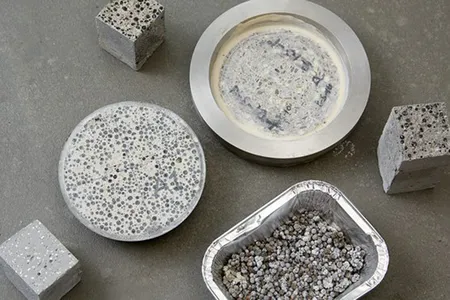 Capsules of limestone-producing bacteria are embedded in the concrete.