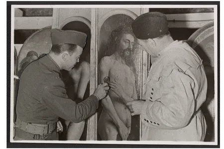 Lieutenant Daniel J. Kern and Karl Sieber examining a panel of the Ghent Altarpiece, 1945.