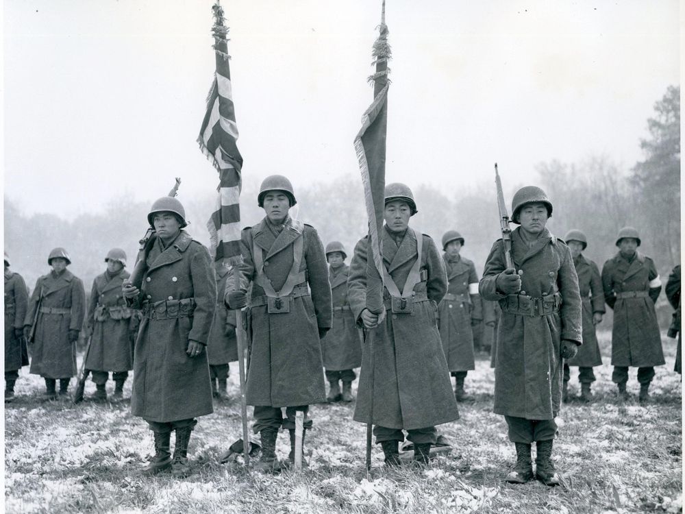 Stunned survivors of the Lost Battalion rescue stand ready for review by General Dahlquist