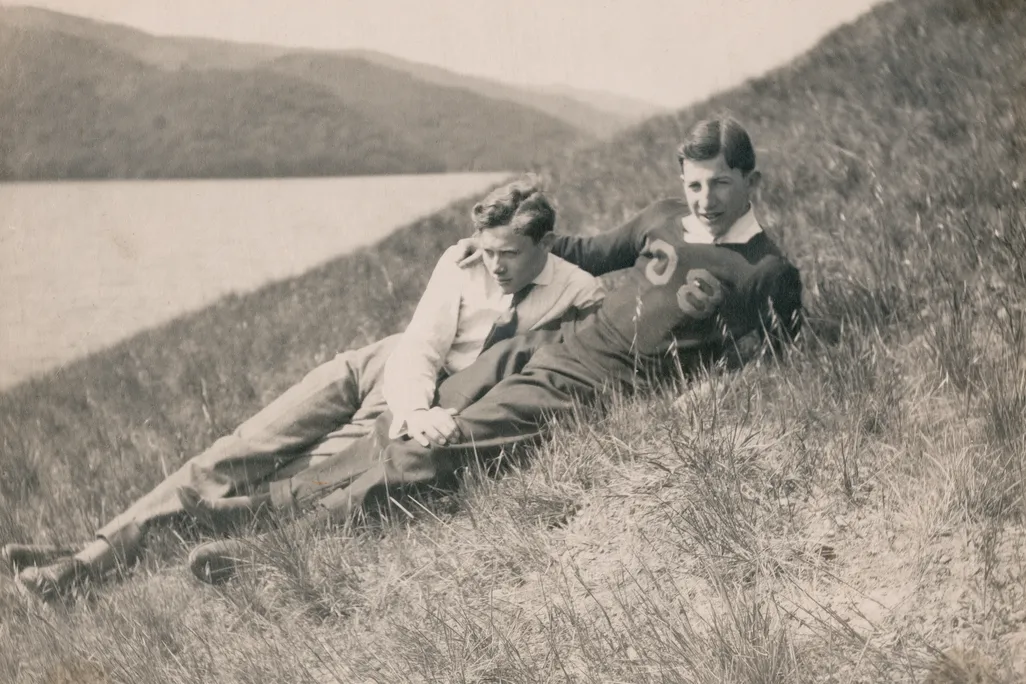 Black and white photo of two men on a hillside