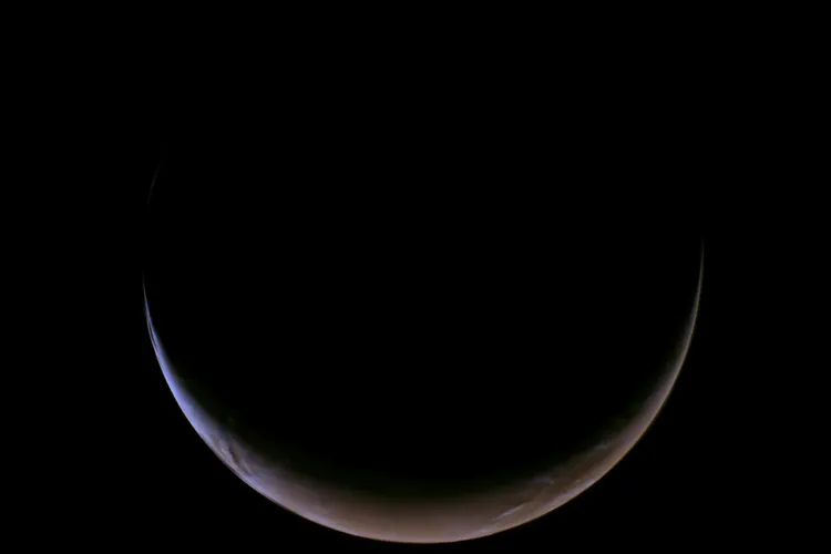 Mars appears as a crescent pointed up, like a smile