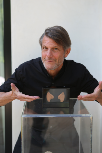 Man poses with Spock ears in box