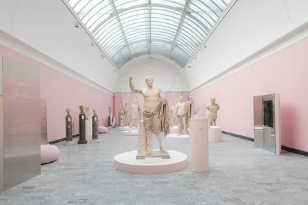 A portrait sculpture of the emperor Tiberius, whose toga was originally painted pink, is the new exhibition's thematic centerpiece.