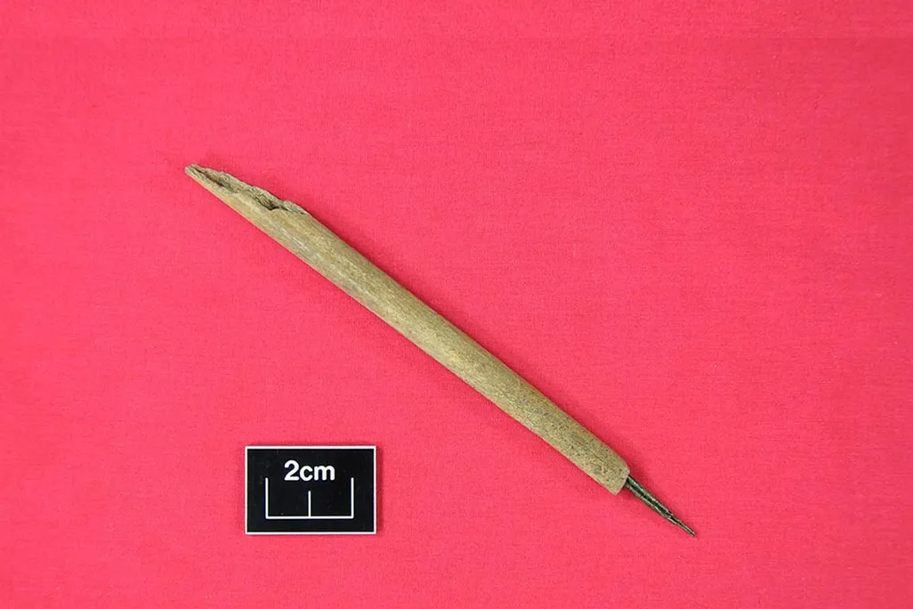 medieval ink pen made of bone and copper