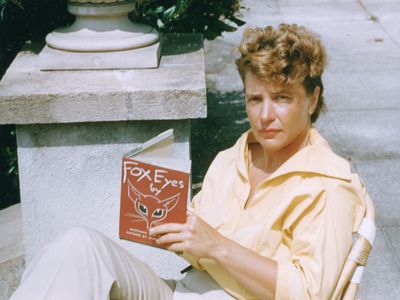 Margaret at Stafford House on Cumberland Island, holding her first copy of Fox Eyes, illustrated by Jean Charlot. This story was inspired by her time on Cumberland as a teenager.