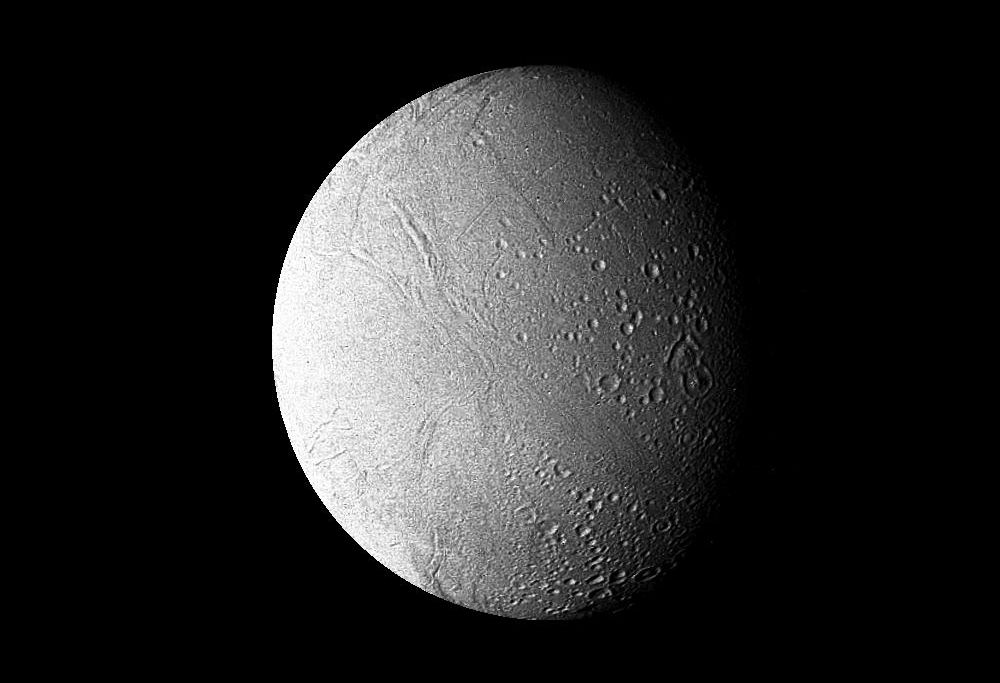 a cratered, spherical, white moon against a black background