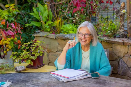 Cathy smiling from her garden