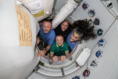 The Crew-9 members&mdash;Butch Wimore, Nick Hague, and Suni Williams of NASA and Roscosmos cosmonaut Aleksandr Gorbunov&mdash;stand inside the vestibule between the ISS and their spacecraft on February 19.