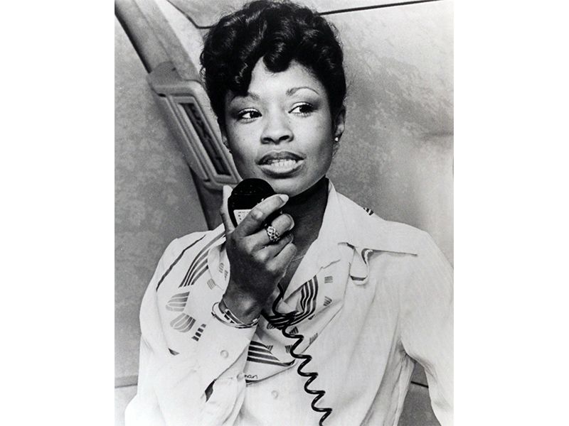 black and white photo of a flight attendant