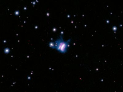 This Giant Cosmic 'Butterfly' Is a Planet-Forming Disk image