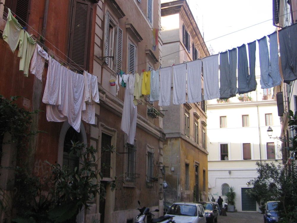 Laundry is hung to dry above an Italian street
