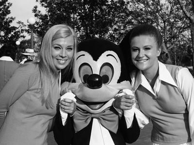 In October 1971, Disney World &quot;cast members&quot; pose with celebrity Mickey Mouse at one of the theme park&#39;s grand opening ceremonies.&nbsp;
