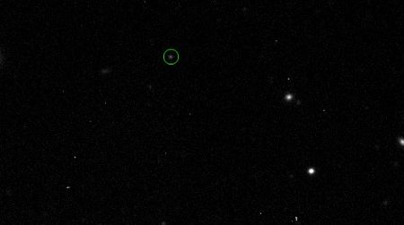 Astronomers traced 2011 QF99, circled in green, across the sky to find that it shared an orbit with Uranus.